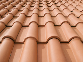 New orange roof tiles close up detail