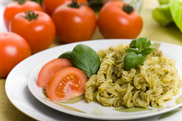 Spaghetti with pesto sauce and cheese