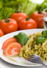 Spaghetti with pesto sauce and cheese