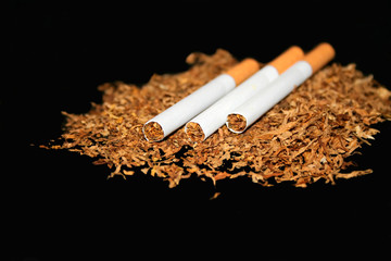 Three cigarettes on a black background