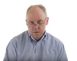 Old Guy in Blue Shirt Looking Over Glasses