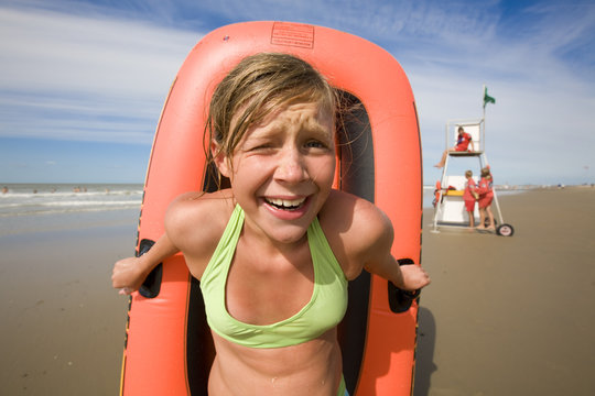 girl with her inflatable boat at the beach
