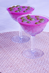 blue berry mousse with green grapes on white