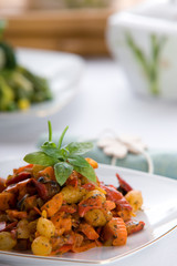 Fresh red vegetable salad with corn and basil