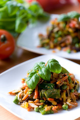 Fresh red vegetable salad with corn and basil
