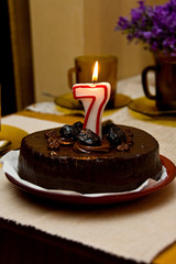 Birthday cake with figure-shaped candle