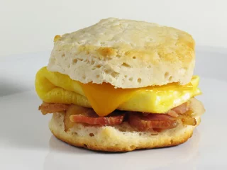 Fotobehang Spiegeleieren Bacon & Egg Biscuit