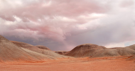 Fototapeta na wymiar Sand dunes under a dramatic sky near Monument Valley