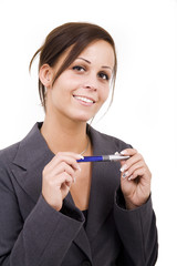 Thinking woman with pen on isolated background