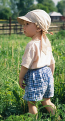 little boy stand in a high grass (2)