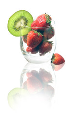 Glass with a strawberry and kiwi isolated on a white background.