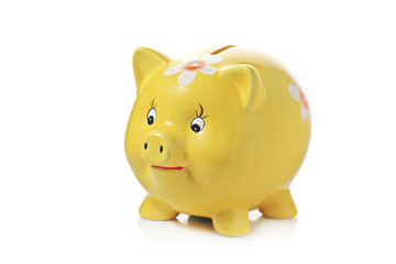 Yellow piggy bank isolated on white background