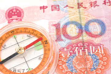 Fototapeta na wymiar Compass on renminbi