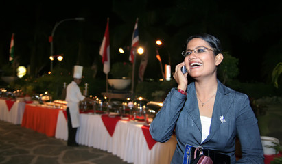 bisiness woman calling at buffet dinner