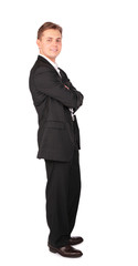 Young man in suit posing cross hands