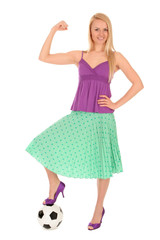 Young adult woman with foot on soccer ball