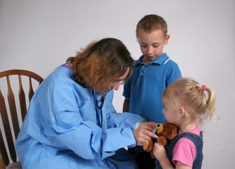 Nurse with boy and girl patients