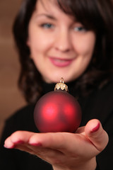 woman hold christmas ball on hand