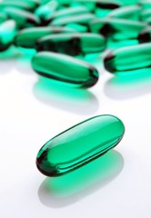 Green caspules on white background