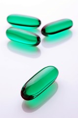 Green caspules on white background