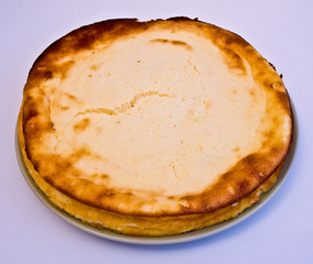 whole cheese cake on the white background
