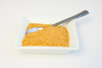 not refined brown sugar with a teaspoon