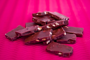 a close-up of chocolate pieces on colorful background
