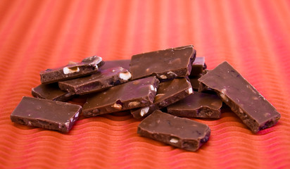 a close-up of chocolate pieces on colorful background