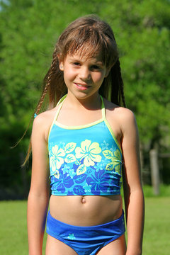 Cute little Girl wearing a Hawaiian Bathing Suit