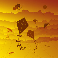 kites flying against a sunset sky 
