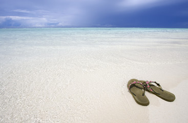 Sandals at exotic beach Maldives