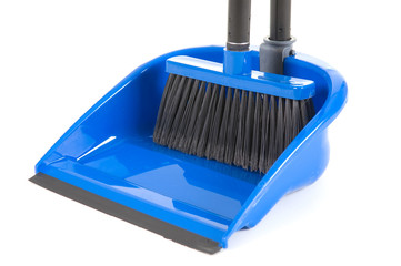 close-up of plastic broom with dustpan