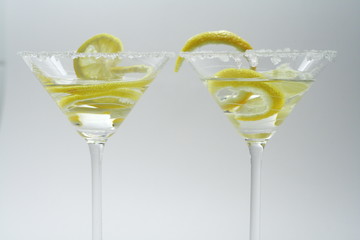 Martini with sugar crust, lemon and peels