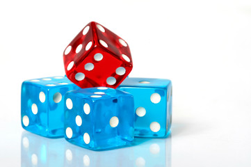 Stack of red and blue dice on a white background
