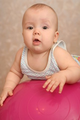 The kid on a bright ball