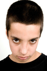 Obraz premium teenage boy with big brown eyes looking sad