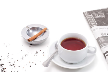 Tea, ashtray and newspaper