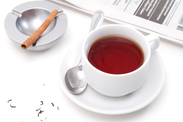 Tea, ashtray and newspaper