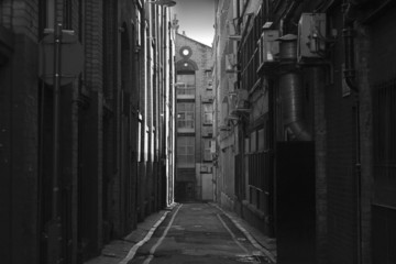 Looking down a long dark back alley - 7355880