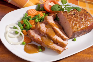  roast tenderloin pork served with vegetables