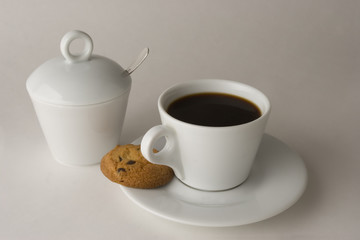 Cup of black coffee with cookies, clipping path included