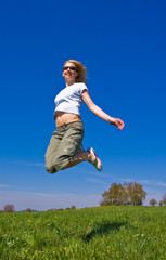young female having fun on flowery meadow