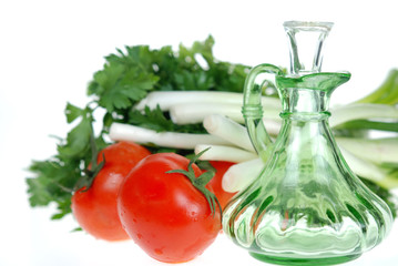 Fresh tomato, onion and parlesy with  salad dressing jar 