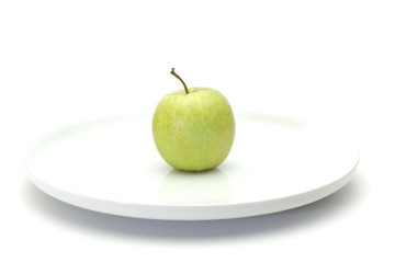 green apple on plate