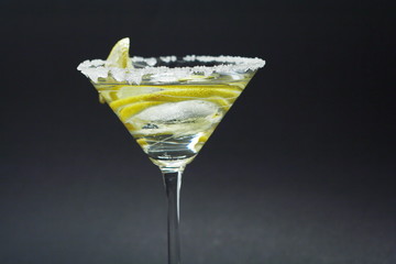 Martini with sugar crust, lemon and peels