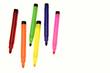 Colorful pens on white background