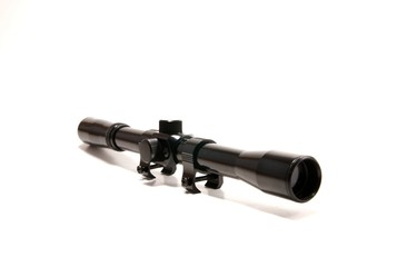 A gun scope 4x20 on a white seemless background.