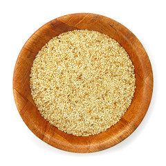 Sesame in wooden dish isolated on white