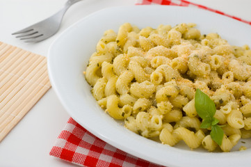 plate of macaroni with basil
