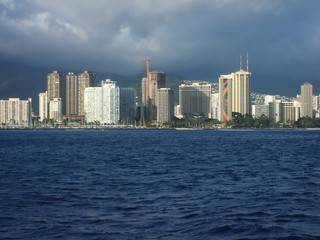 Fototapeta na wymiar Bright Towers of Honolulu Skyline Viewed From Ocean, Hawaii